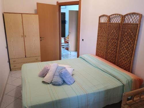 Ένα ή περισσότερα κρεβάτια σε δωμάτιο στο Apartment Rose e Fiori Sardegna