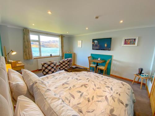 a living room with a bed and a couch at An-Airidh Bed & Breakfast Portree in Portree