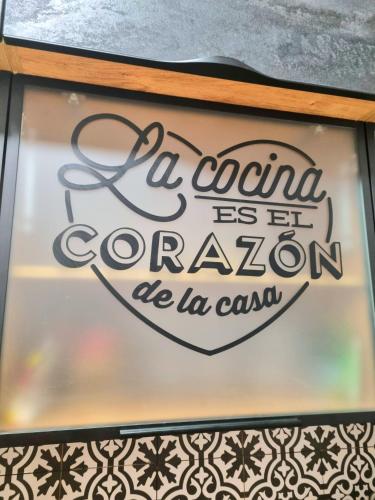 a sign in a window that reads a son is est convention be la son at Old Town #Menorah #MostCity in Dnipro