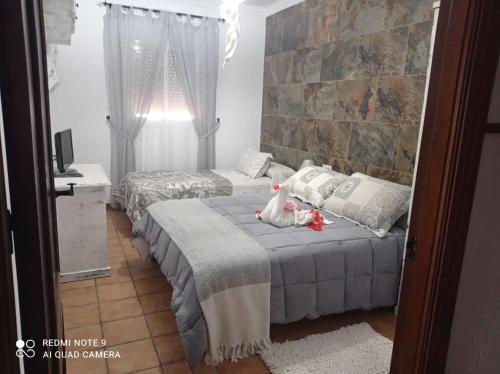 Postel nebo postele na pokoji v ubytování FINCA LOS CHATOS