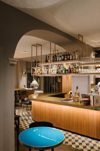 a kitchen with a counter and a blue table at Hotel Ristorante Eurossola in Domodossola