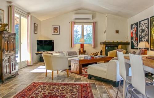 a living room with a table and chairs at Gorgeous Home In Tourrettes in Tourrettes