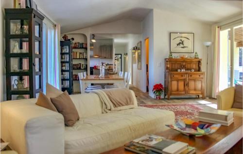 a living room with a white couch and a table at Gorgeous Home In Tourrettes in Tourrettes