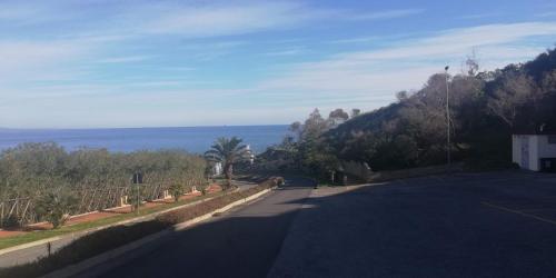 an empty road with a view of the ocean at Residenza Anna Maria in Crotone