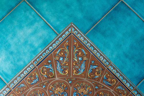 a close up of a wooden pattern on a blue wall at Villa San Cosma in Ravello