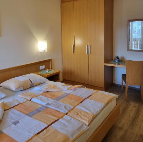 Postel nebo postele na pokoji v ubytování Apartments AD Radenci
