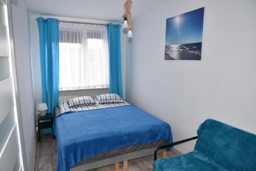 Posteľ alebo postele v izbe v ubytovaní Apartament SanPaulo
