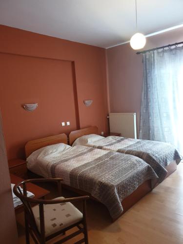 מיטה או מיטות בחדר ב-Krystal Hotel