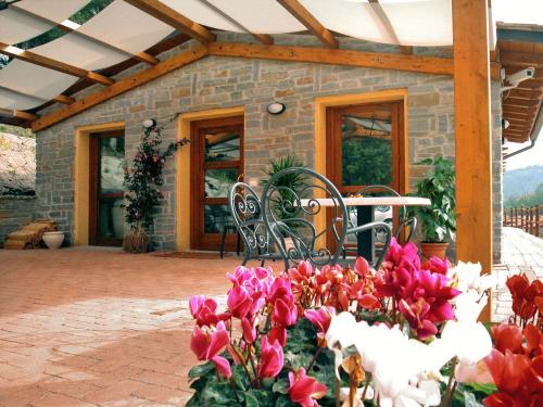 a bunch of flowers in front of a building at Lebbiano Residence in Scandicci