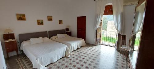 A bed or beds in a room at Casa Castellitx Mallorca