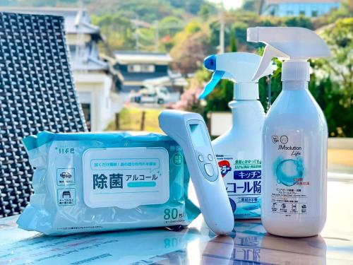 a table with two bottles of soap and a scale at Sparky’s House in Naoshima