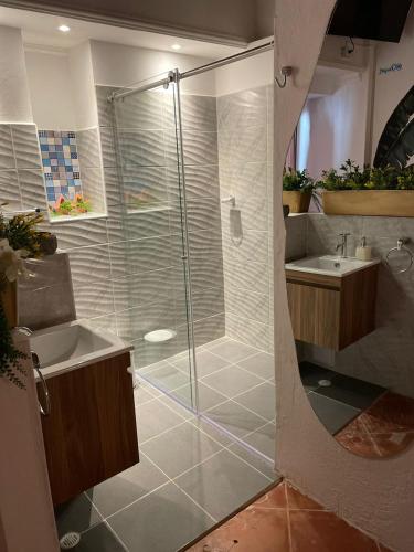 a bathroom with a shower and a sink at Candilejo Hotel Boutique in Cartagena de Indias