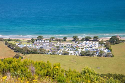 an aerial view of a resort on the beach at BIG4 Apollo Bay Pisces Holiday Park in Apollo Bay