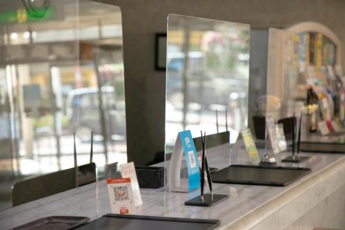 a counter with a row of laptops on it at Main Hotel - Vacation STAY 82545 in Miyakonozyō