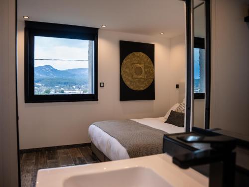 Postel nebo postele na pokoji v ubytování TERRASSE PROVENCE PAGNOL*****