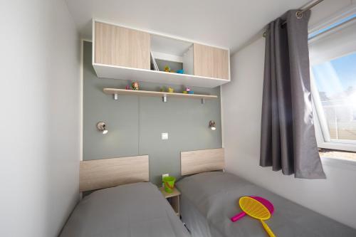 Postel nebo postele na pokoji v ubytování Camping la Simioune en Provence