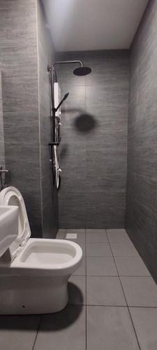 a bathroom with a toilet and a sink and a shower at Bukit Rimau Instagrammable 2 Bedroom Apartment With Pool View up to 5 PAX in Shah Alam