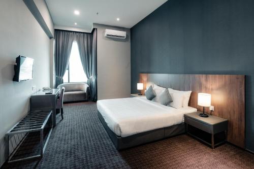 Postel nebo postele na pokoji v ubytování Le'venue Hotel