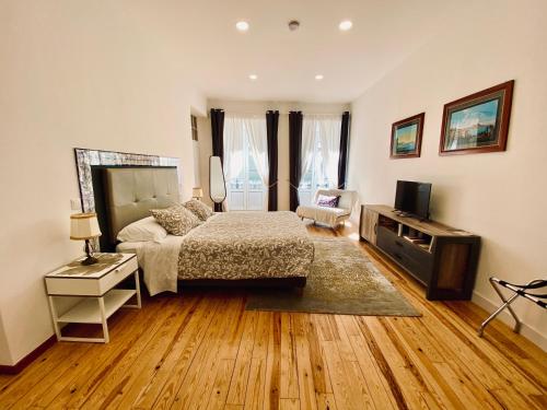 TV a/nebo společenská místnost v ubytování Casa Saudade luxury rooms