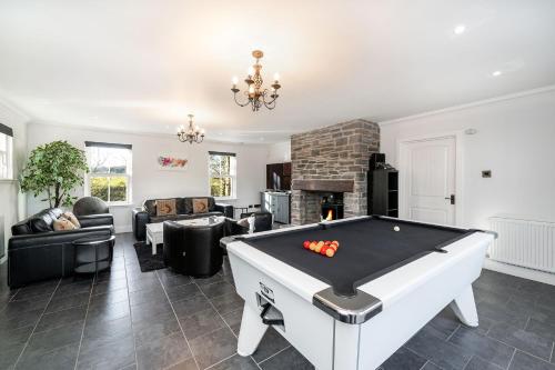 a living room with a pool table at Thatched Cottage in Broughty Ferry