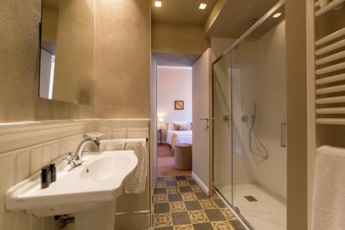 a bathroom with a sink and a shower at Atelier delle Grazie in Florence