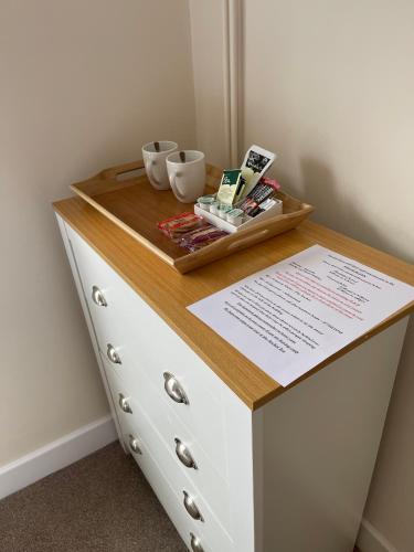 a dresser with a board on top of it at Anchor Inn in Kempsey