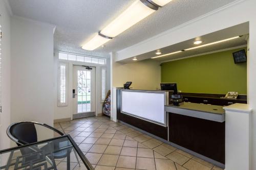 a waiting area with a large screen in a room at Studio 6-Tempe, AZ in Tempe