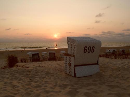 a lifeguard station on the beach at sunset at Sylt Seascape III in Tinnum