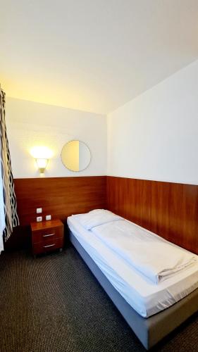 En eller flere senge i et værelse på Hotel Zentrum