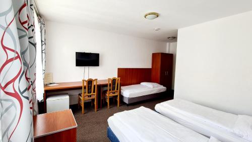 En eller flere senge i et værelse på Hotel Zentrum