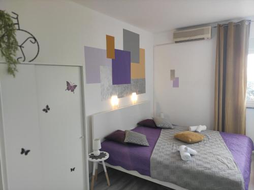Posteľ alebo postele v izbe v ubytovaní Apartman Iris s terasom