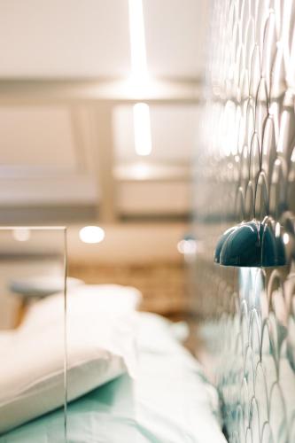 Katil atau katil-katil dalam bilik di Vailato Loft Suites