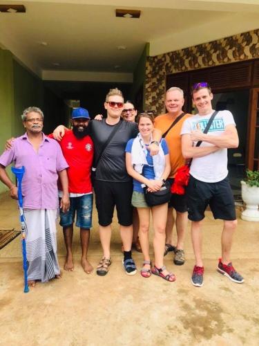 a group of people posing for a picture at The City Tourist Hotel in Anuradhapura