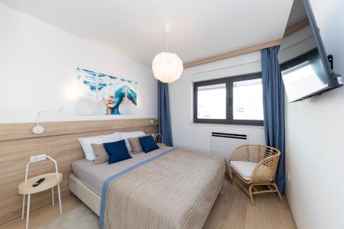 Posteľ alebo postele v izbe v ubytovaní Apartman 4U