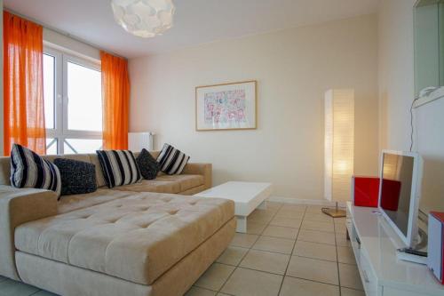 Khu vực ghế ngồi tại Haus-Ostseeapartments-am-Fehmarnsund-Wohnung-28-White-Pearl