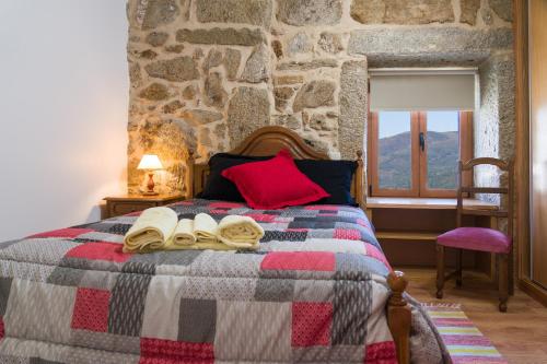 Ένα ή περισσότερα κρεβάτια σε δωμάτιο στο Casa das Eiras