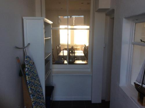 a hallway with a window in a room at Lovely Victorian town house close to the sea. in Bangor