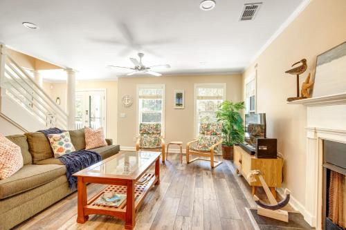 a living room with a couch and a fireplace at Anchors Away in Folly Beach