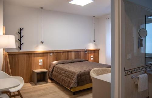 Posteľ alebo postele v izbe v ubytovaní Hotel Oliva