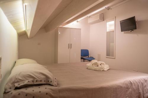 Ένα ή περισσότερα κρεβάτια σε δωμάτιο στο Il Duomo-Cefalù Holiday Apartments