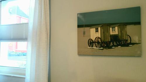 a picture of a painting of a train on a wall at seemoi in Norderney