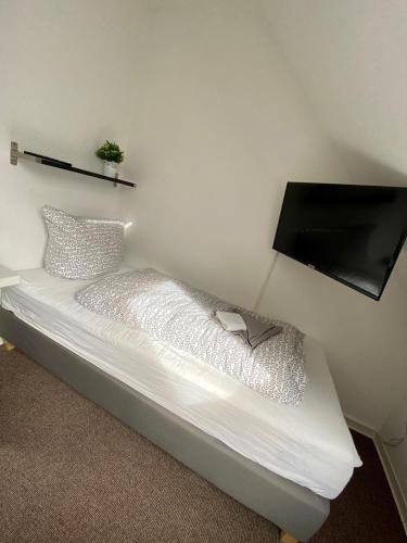 Postel nebo postele na pokoji v ubytování Muschelsucher