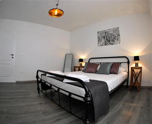 a bedroom with a bed in a room at Apartman “Tica” in Baška Voda