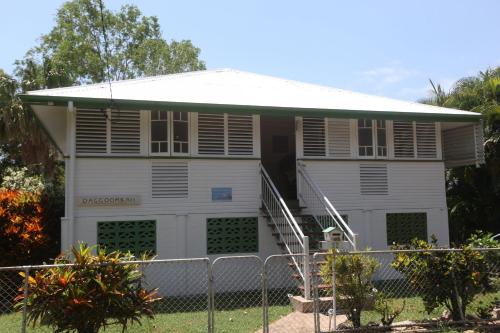 a white house with a fence in front of it at Daggoombah Holiday Home Magnetic Island in Arcadia