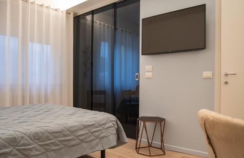 Télévision ou salle de divertissement dans l'établissement Hotel Oliva