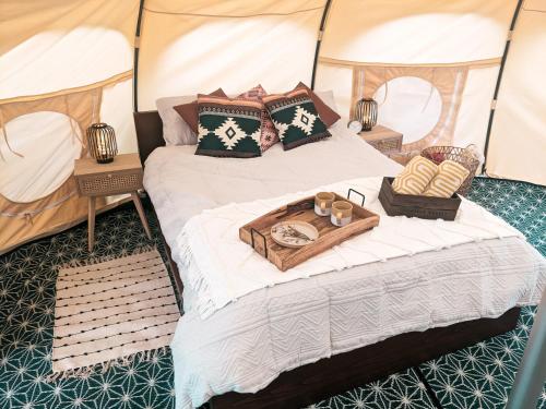 a bedroom with two beds in a tent at Immaculate Lotus Belle Tent Retreat North Devon in Bideford