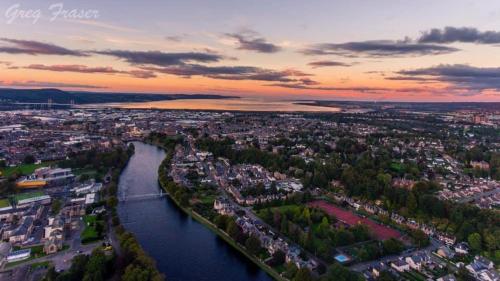 an aerial view of a city with a river at Inverness Holiday Retreat - 2 Bedroom in Inverness