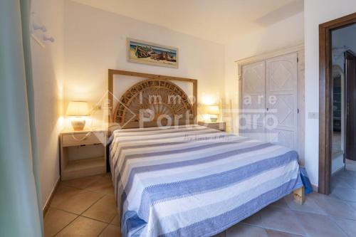 Postel nebo postele na pokoji v ubytování L305 - Porto Mannu suggestivo villino sul mare