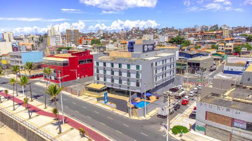 an aerial view of a city with a red building at Hotel Dan Inn Express Salvador By Nacional Inn in Salvador
