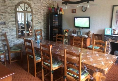 TV a/nebo společenská místnost v ubytování Chambres et table d'hôtes les grivottes